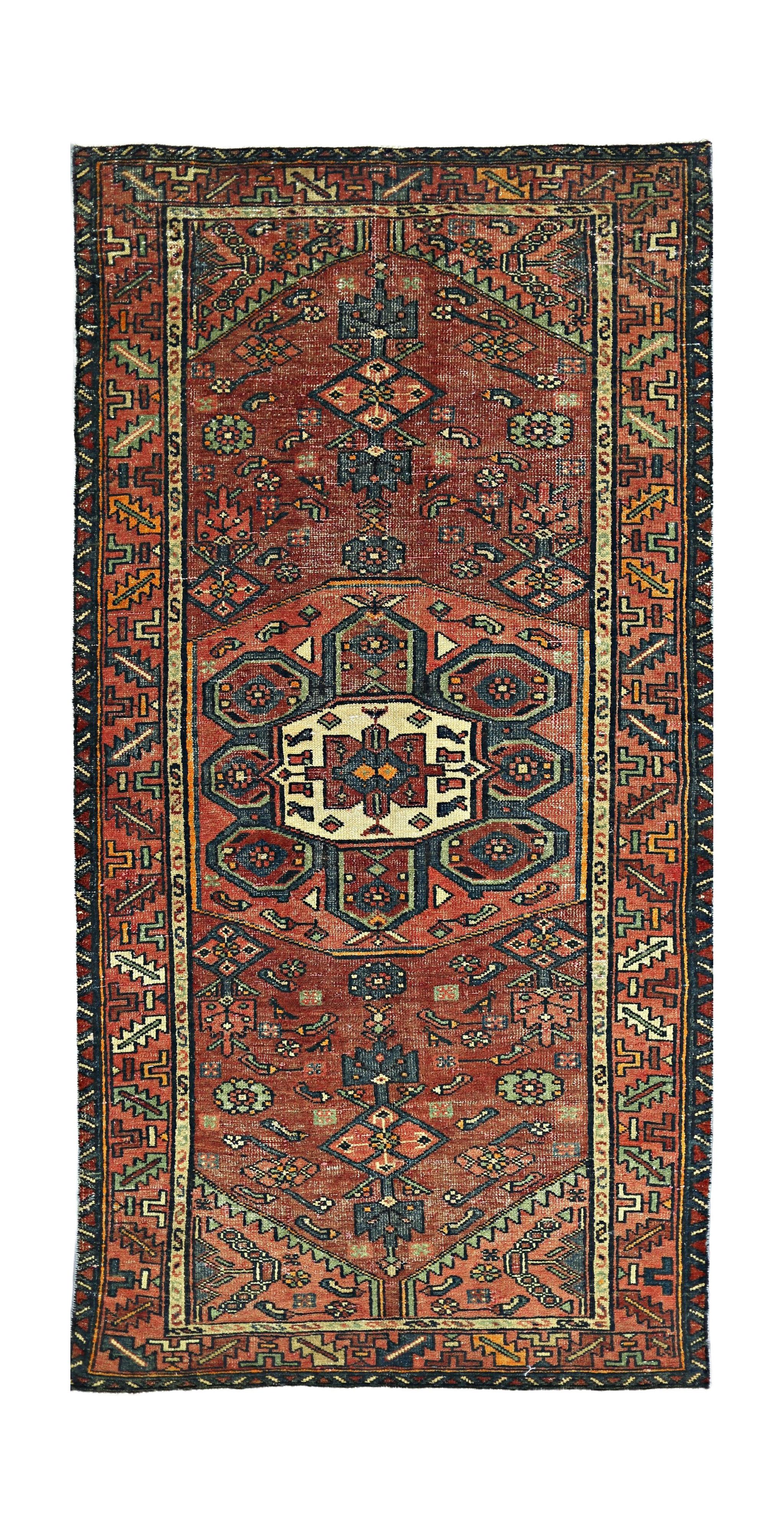 A vintage Persian Hamadan runner featuring a geometric medallion pattern in red, blue, and cream.
