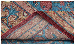 A handwoven Afghan Balkh rug featuring a traditional Khotan pomegranate motif in blue and red.