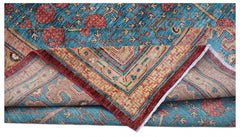 A handwoven Afghan Balkh rug featuring a blue field with pomegranate motifs and a patterned border.