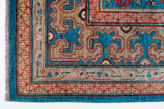 A handwoven Afghan Balkh rug featuring a geometric Khotan pattern in blue, red, and tan tones.