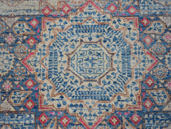 A handmade Afghan Balkh rug featuring a detailed blue and beige Mamluk medallion pattern.
