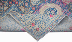 Handwoven Afghan Balkh rug with a blue and cream Mamluk medallion pattern and fringed edges.