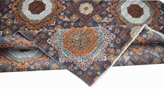 A handwoven Afghan Balkh rug featuring a detailed Mamluk medallion pattern in blue and rust tones.