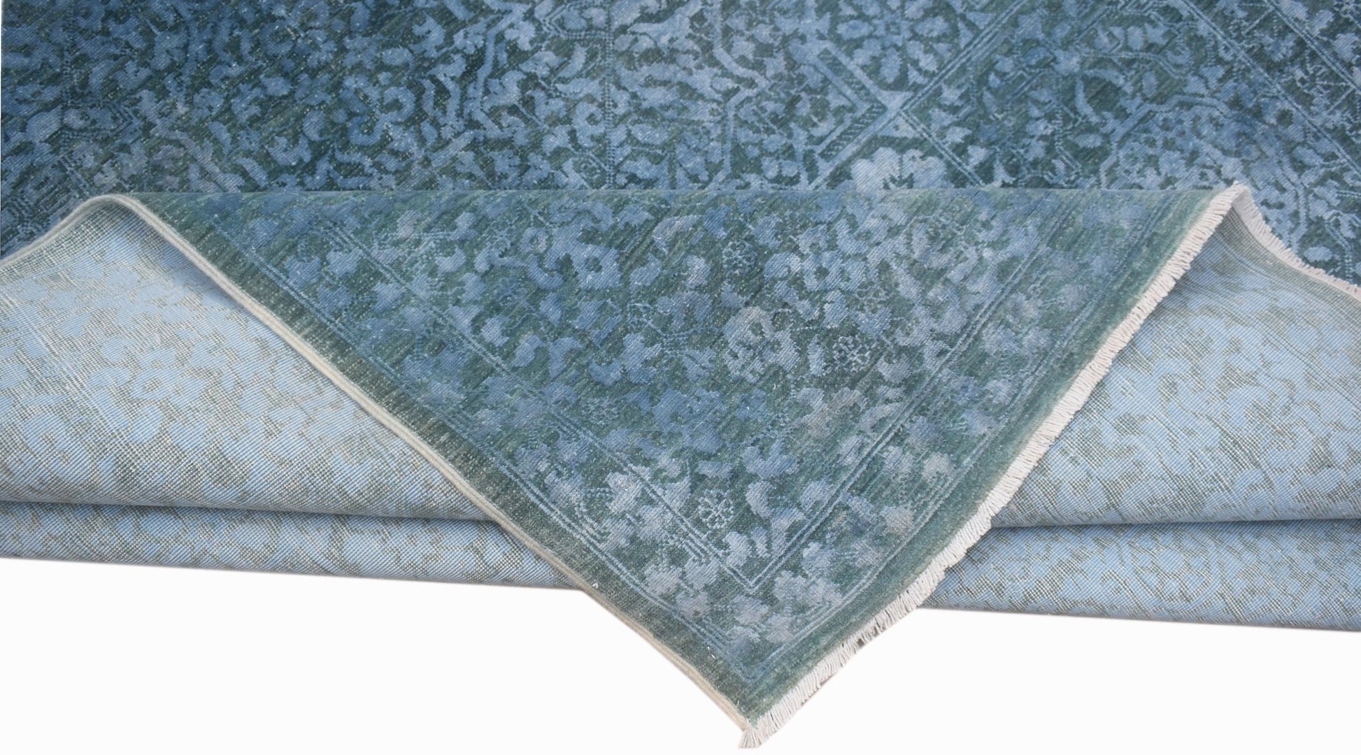 A handwoven Afghan Balkh rug in blue with a traditional Mamluk medallion pattern.