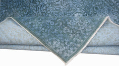A handwoven Afghan Balkh rug in blue with a traditional Mamluk medallion pattern.