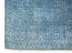 A handwoven Afghan Balkh rug featuring a detailed blue Mamluk pattern with a fringed edge.