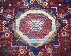 Handwoven Afghan Balkh rug featuring a detailed Mamluk medallion pattern in red and blue tones.