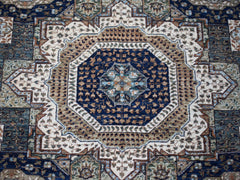 A handwoven Afghan Balkh rug featuring a detailed blue and tan Mamluk medallion pattern.