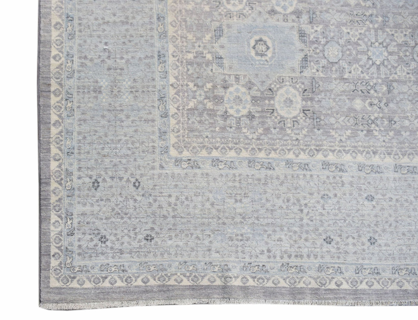 A handwoven Afghan Balkh rug featuring a traditional Mamluk medallion pattern in shades of blue.