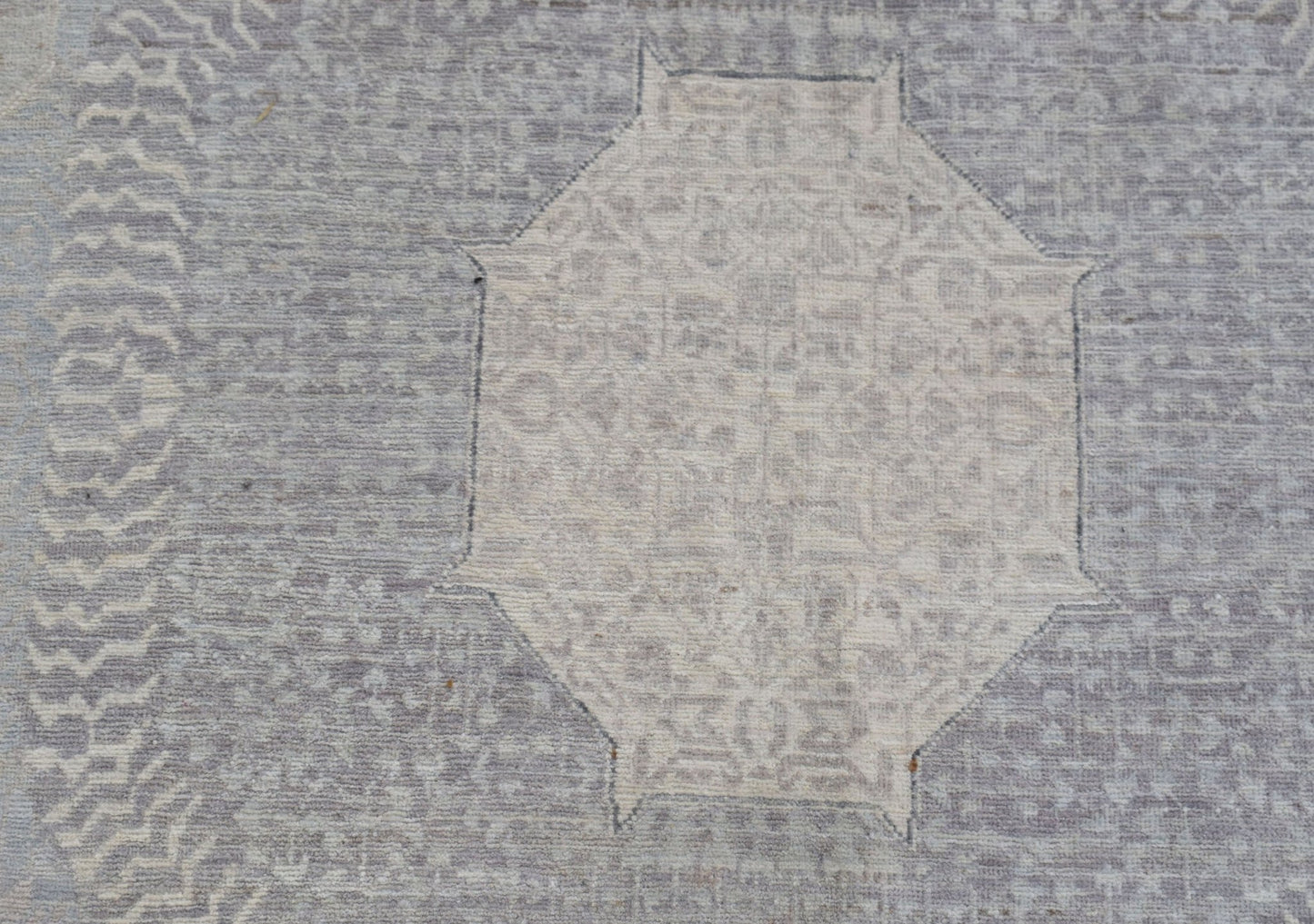 A handwoven Afghan Balkh rug featuring a detailed Mamluk medallion in soft grey and beige tones.