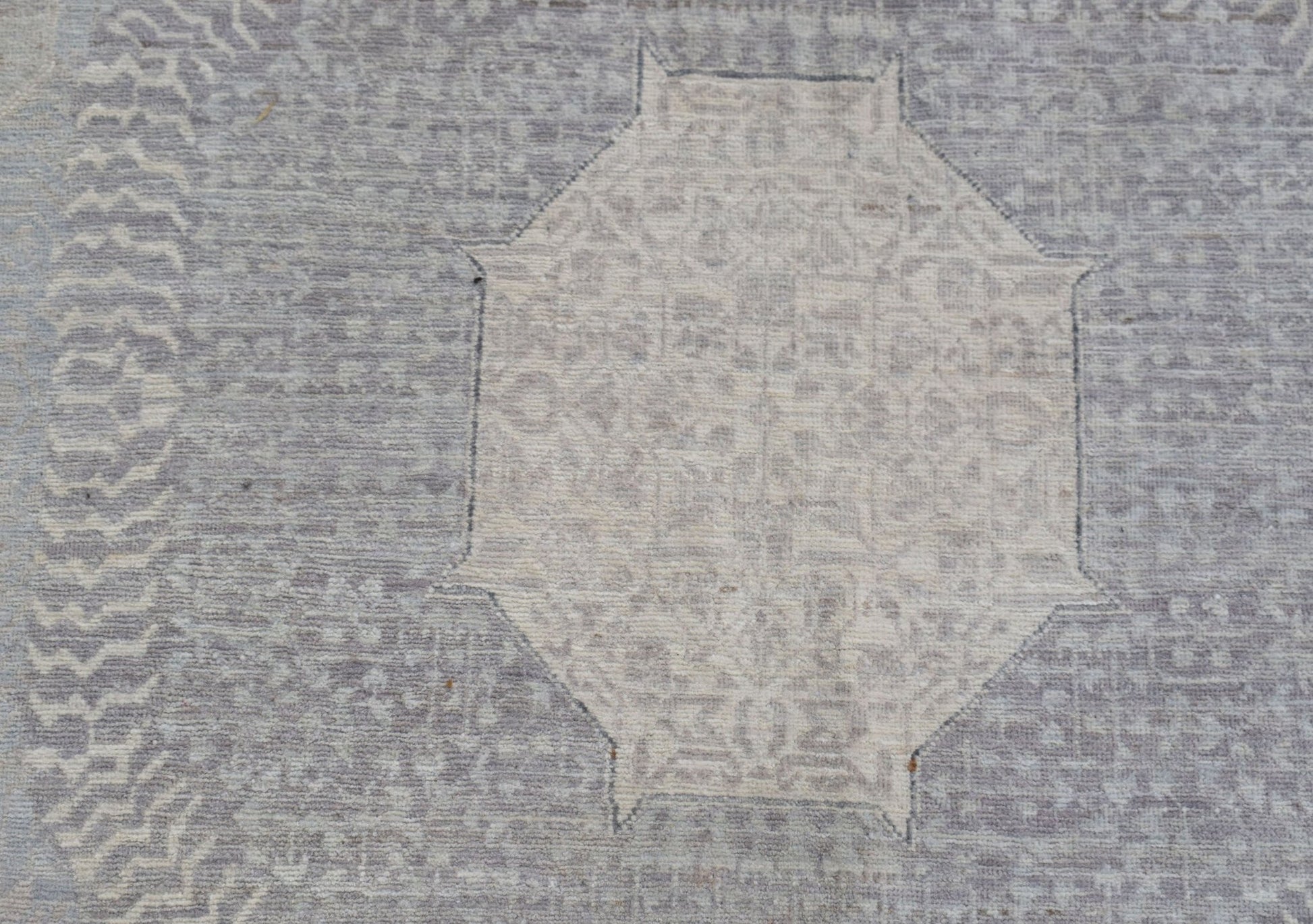 A handwoven Afghan Balkh rug featuring a detailed Mamluk medallion in soft grey and beige tones.