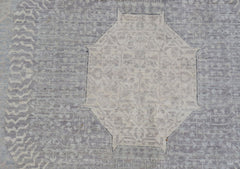 A handwoven Afghan Balkh rug featuring a detailed Mamluk medallion in soft grey and beige tones.