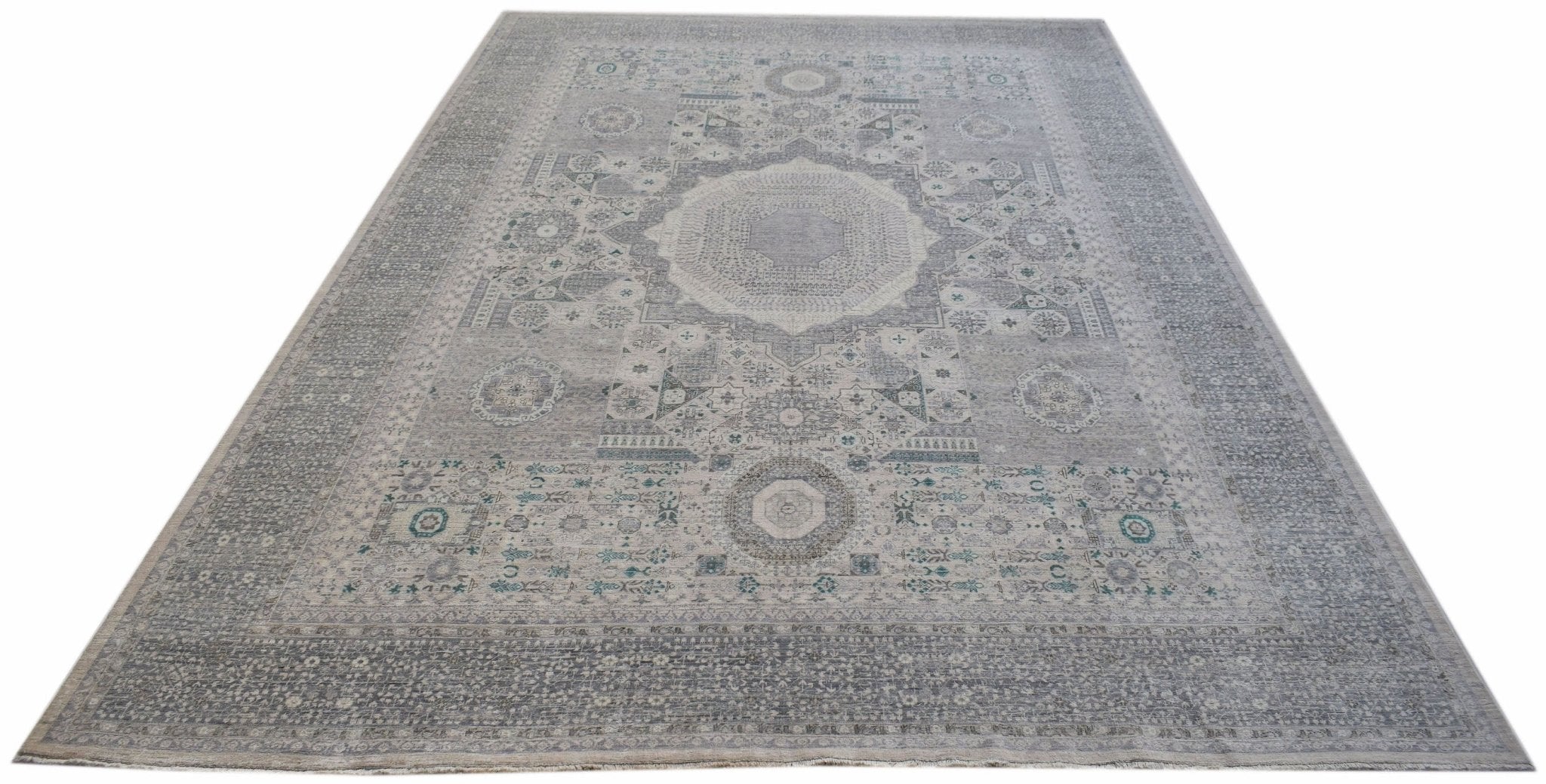 A handwoven Afghan Balkh rug featuring a traditional grey Mamluk medallion pattern.