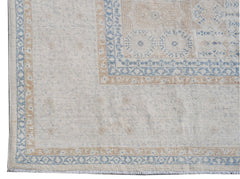 A handwoven Afghan Balkh rug featuring a traditional Mamluk pattern in soft blue and beige tones.