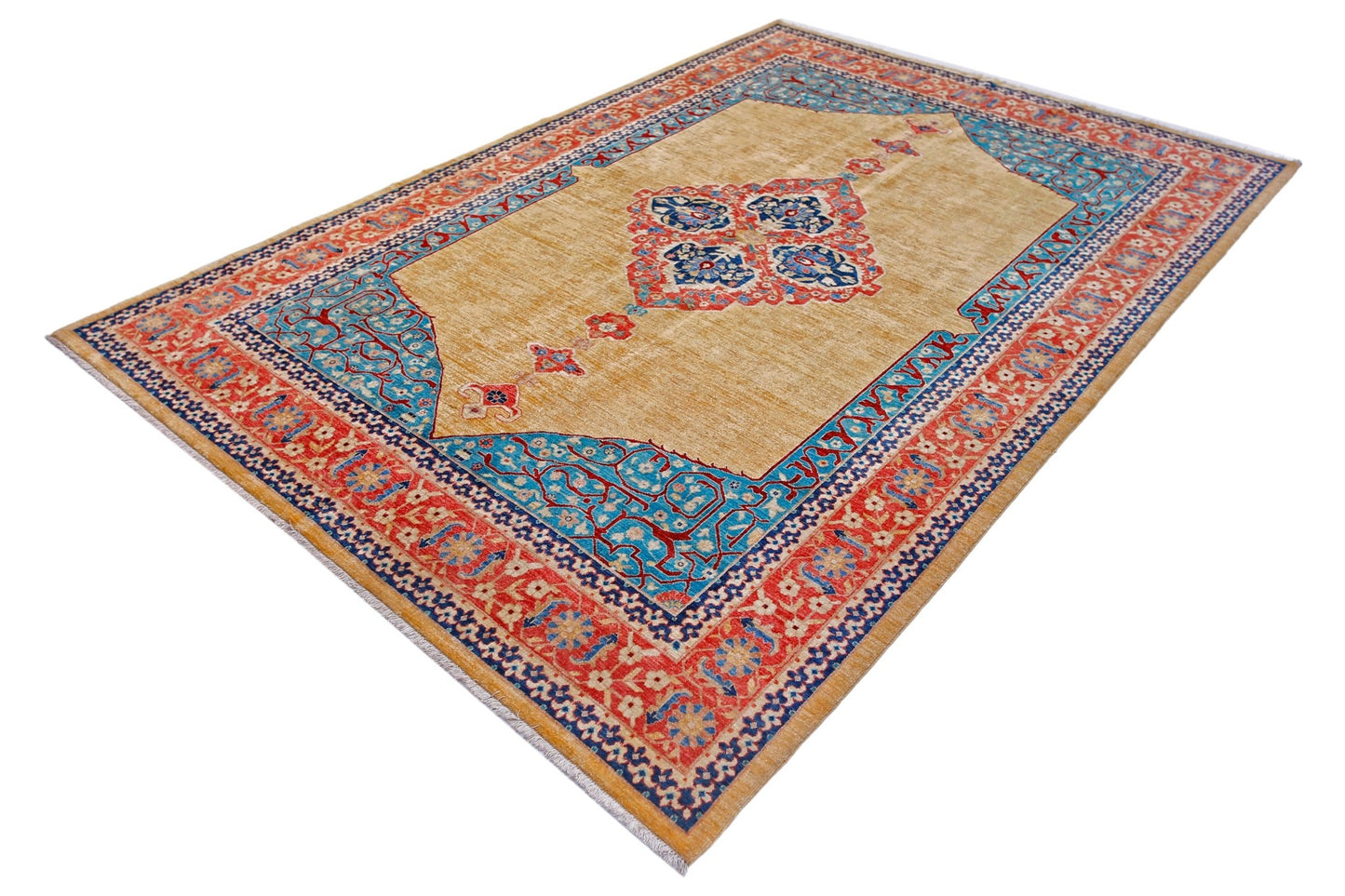A rectangular Afghan Balkh rug featuring a central floral medallion on a tan field with blue borders.