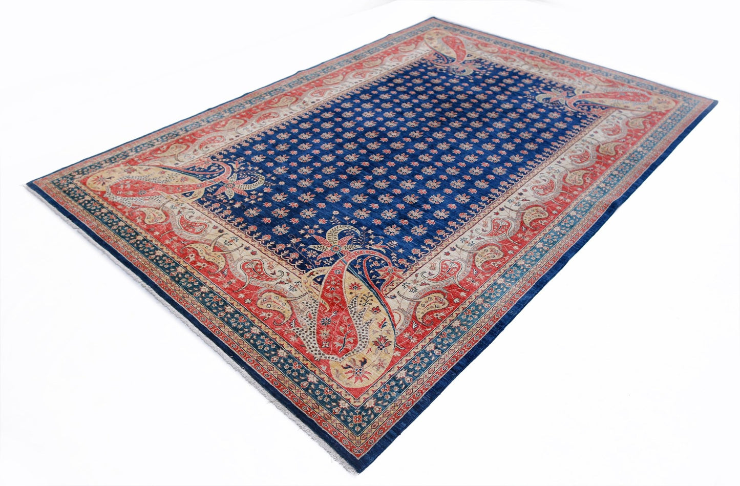 A rectangular Afghan Balkh rug featuring a blue field with floral motifs and a red paisley border.