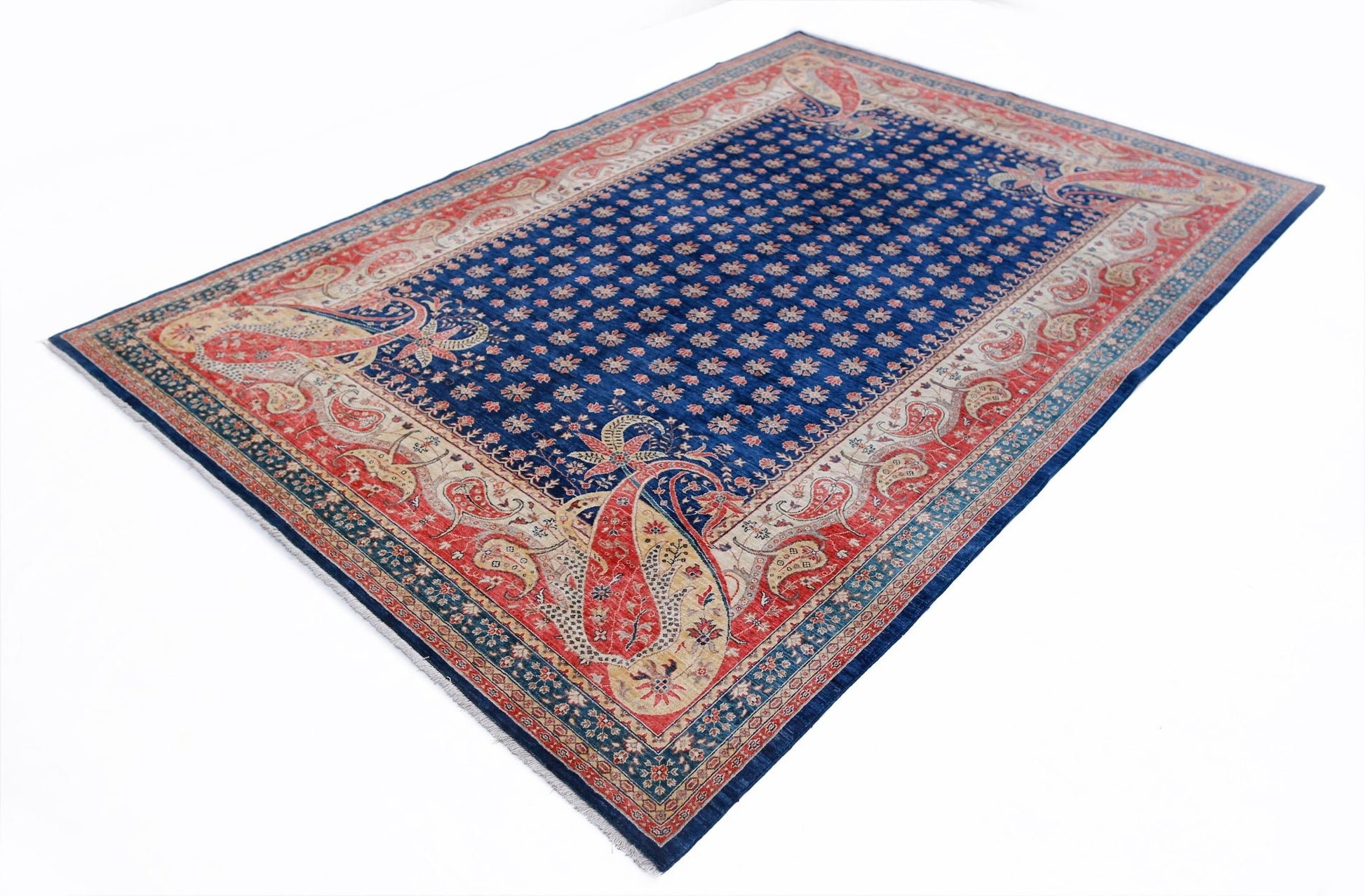 A rectangular Afghan Balkh rug featuring a blue field with floral motifs and a red paisley border.