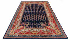 Handwoven Afghan Balkh rug featuring a dark blue field with floral motifs and red paisley borders.