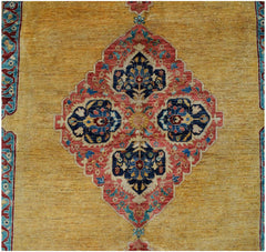 An Afghan Balkh rug featuring a central floral medallion in red and blue on a golden yellow field.