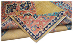 An Afghan Balkh rug with a yellow field and intricate floral patterns in red and blue.