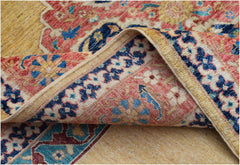 A handmade Afghan Balkh rug featuring a traditional floral pattern in shades of blue, red, and gold.