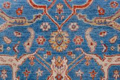 Handwoven Afghan Balkh rug featuring a traditional floral pattern in blue, red, and cream tones.
