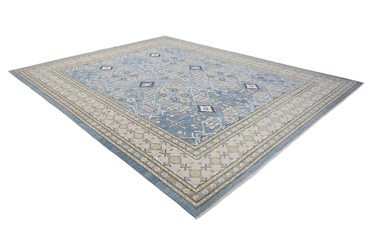 An Afghan Balkh rug featuring a traditional floral pattern in blue and beige tones.