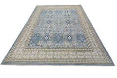 An Afghan Balkh rug featuring a blue field with intricate floral patterns and geometric motifs.