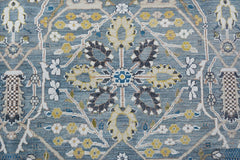 Handmade Afghan Balkh rug featuring a traditional floral medallion pattern in blue and yellow tones.