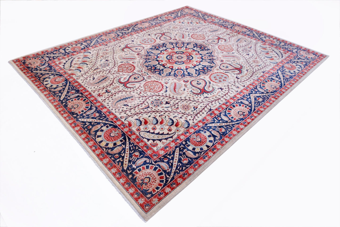 A rectangular Afghan Balkh rug featuring a central floral medallion on a cream field with blue borders.