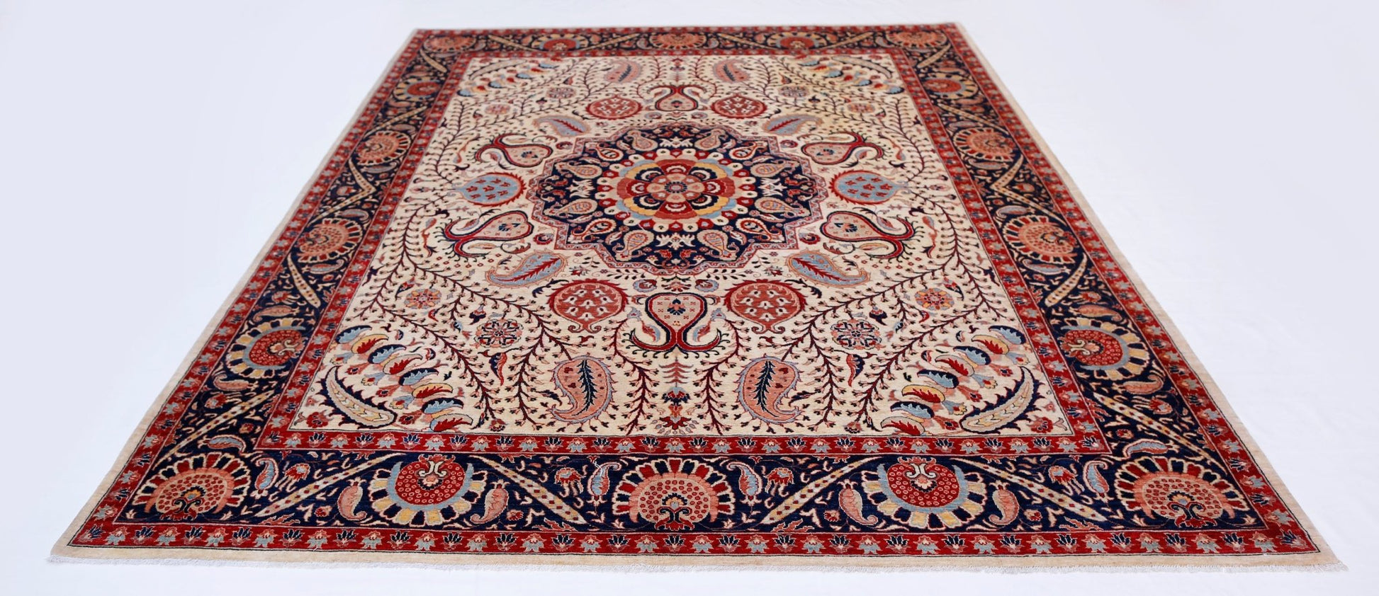 Handwoven Afghan Balkh rug featuring a traditional floral medallion pattern in red and blue tones.