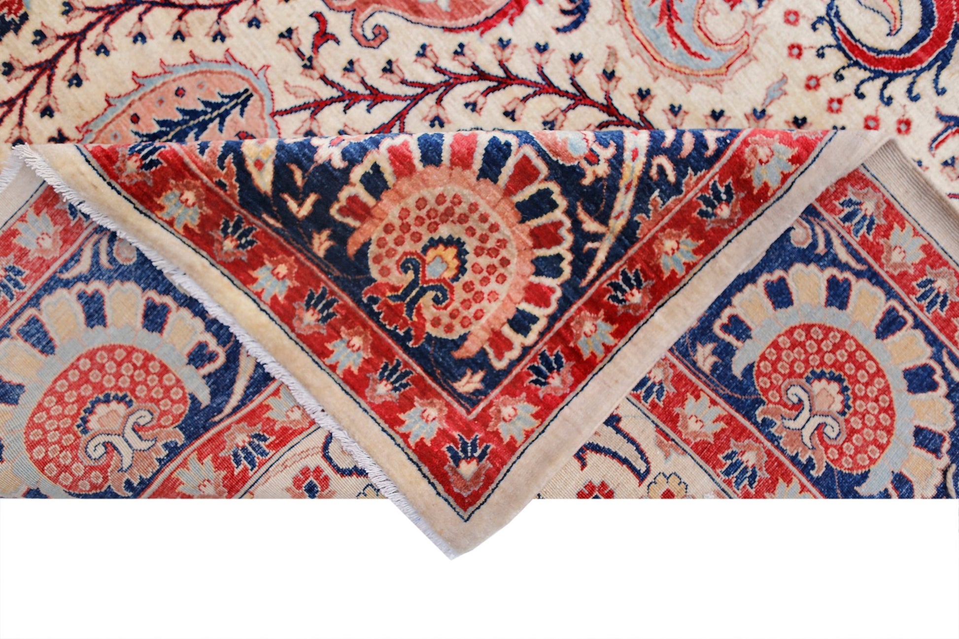 A handwoven Afghan Balkh rug featuring a traditional floral pattern in red, blue, and cream.