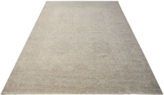 A handwoven Afghan Balkh rug featuring a traditional, subtle floral pattern in neutral beige tones.