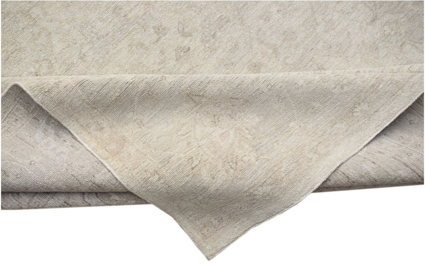 A handwoven Afghan Balkh rug in neutral beige tones with a subtle traditional pattern.