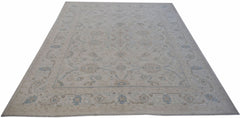 Handwoven Afghan Balkh rug featuring a traditional floral pattern in soft blue and beige tones.