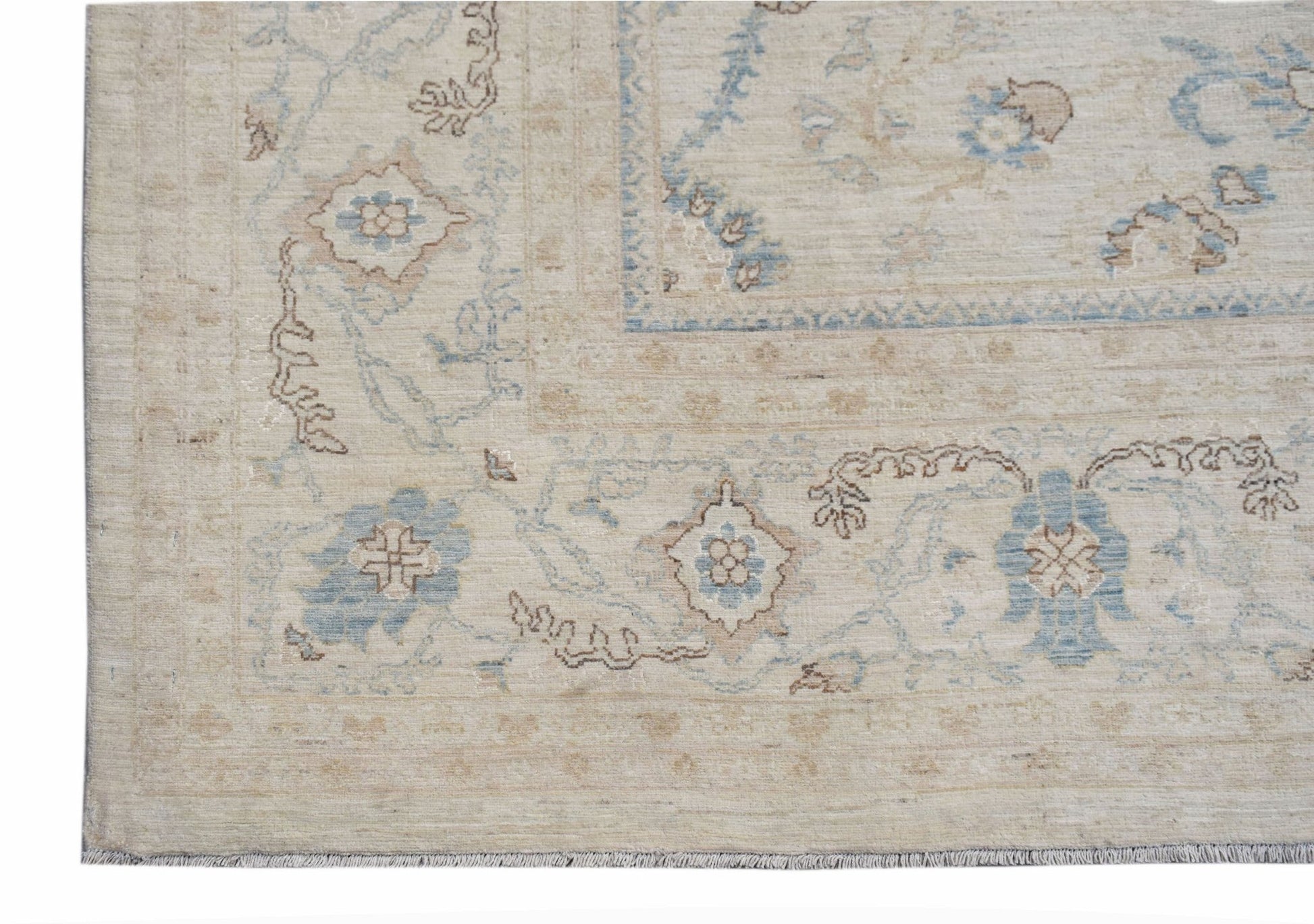 A handwoven Afghan Balkh rug featuring a traditional floral pattern in soft blue and beige tones.