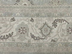 A handmade Afghan Balkh rug featuring a neutral palette with traditional floral and geometric motifs.