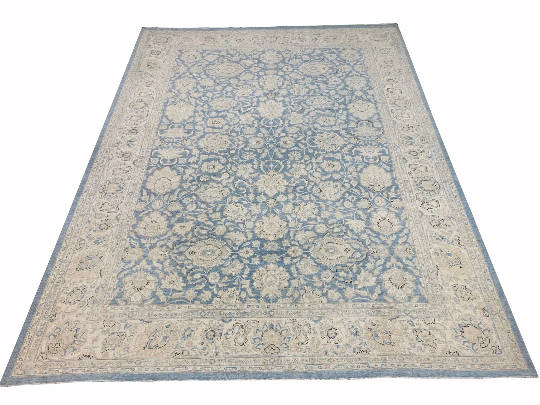 An Afghan Balkh rug featuring a traditional floral pattern in shades of blue and cream.