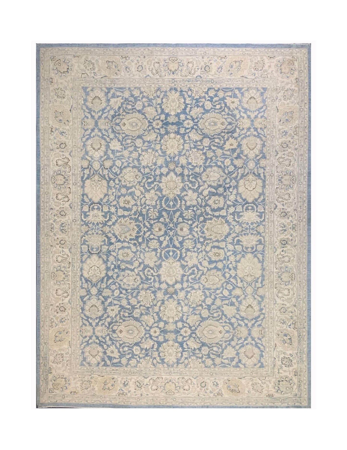 An Afghan Balkh rug featuring a traditional floral pattern in shades of blue and cream.