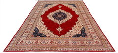 Handwoven Afghan Balkh rug featuring a central navy medallion on a red field with floral borders.