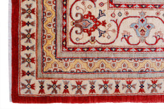 A handwoven Afghan Balkh rug featuring a traditional floral pattern in red, cream, and gold tones.