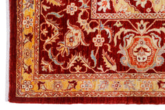 A handwoven Afghan Balkh rug featuring a traditional floral pattern in deep red and gold tones.