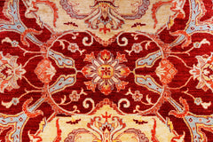 A handwoven Afghan Balkh rug featuring a traditional floral pattern in red, cream, and blue tones.