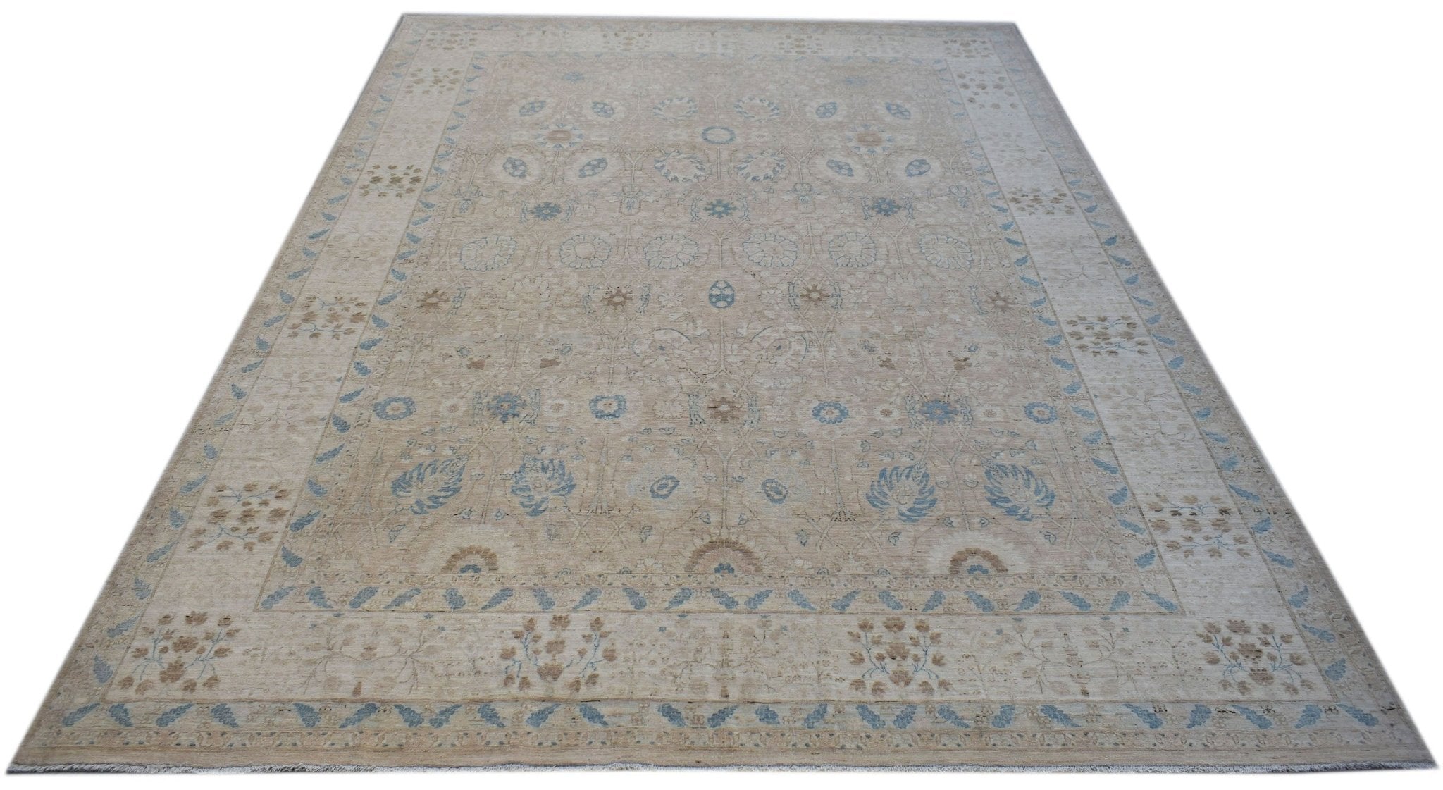A handwoven Afghan Balkh rug featuring a traditional floral pattern in soft beige and blue tones.