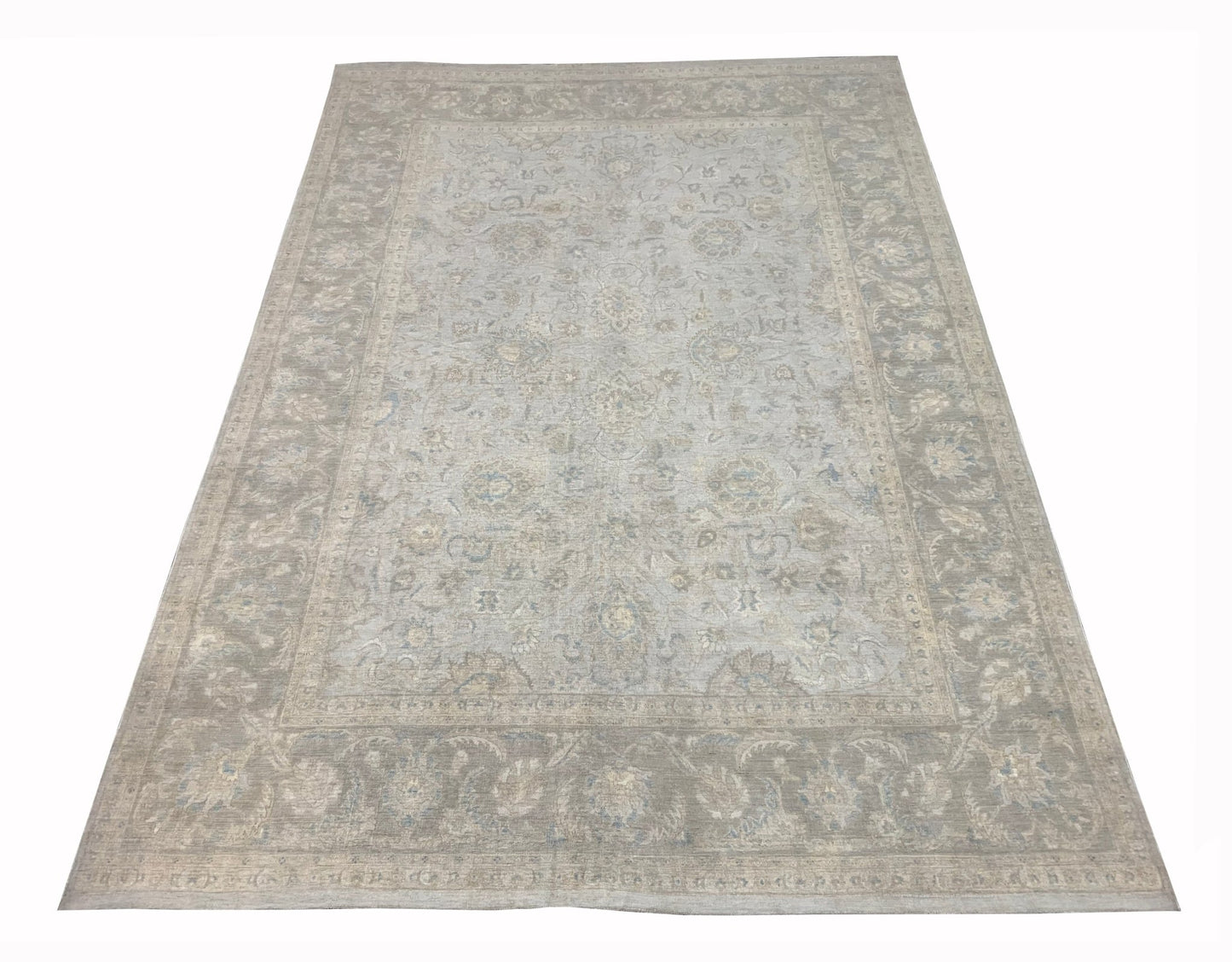 A handmade Afghan Balkh rug featuring a traditional floral pattern in soft grey and beige tones.