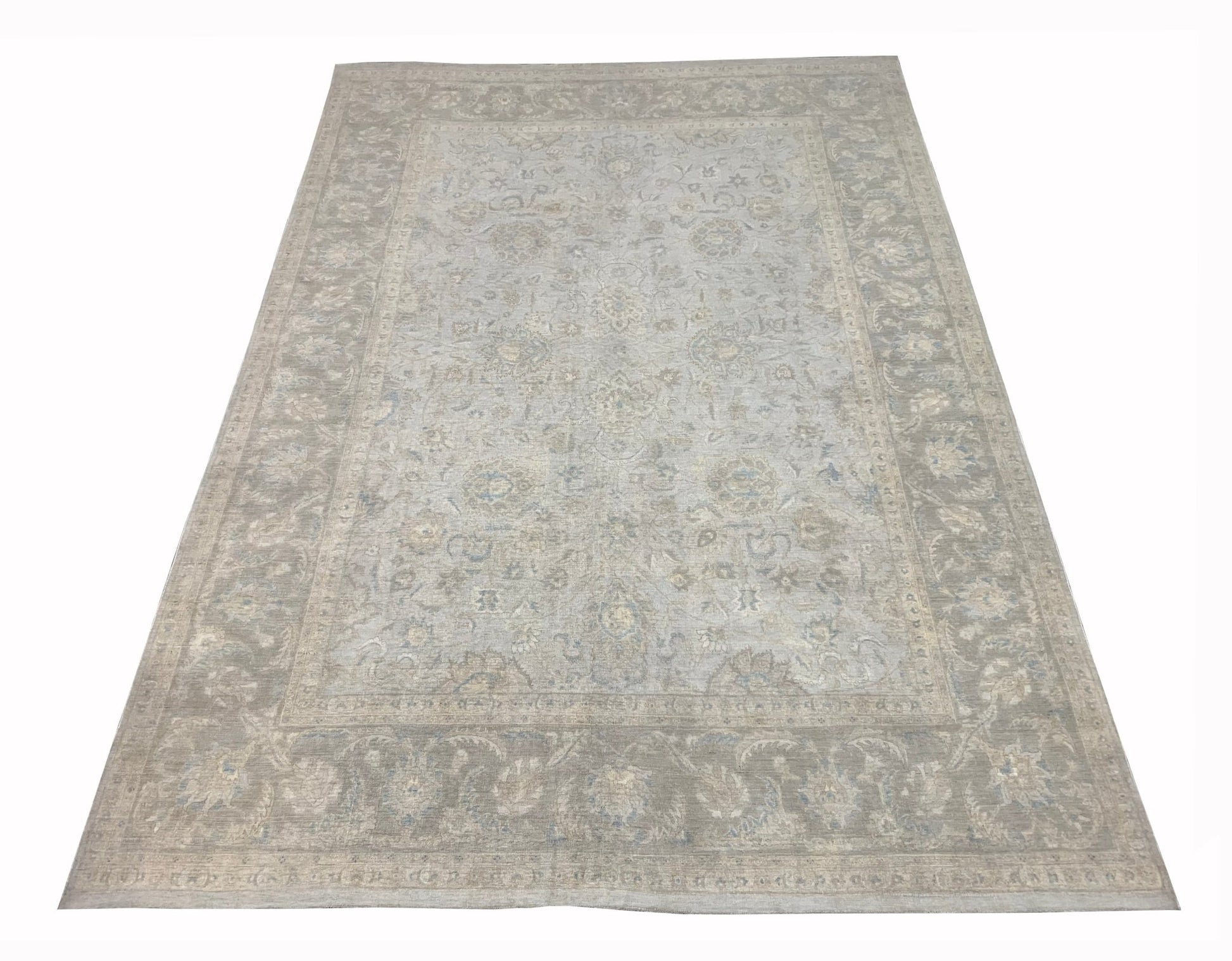 A handmade Afghan Balkh rug featuring a traditional floral pattern in soft grey and beige tones.