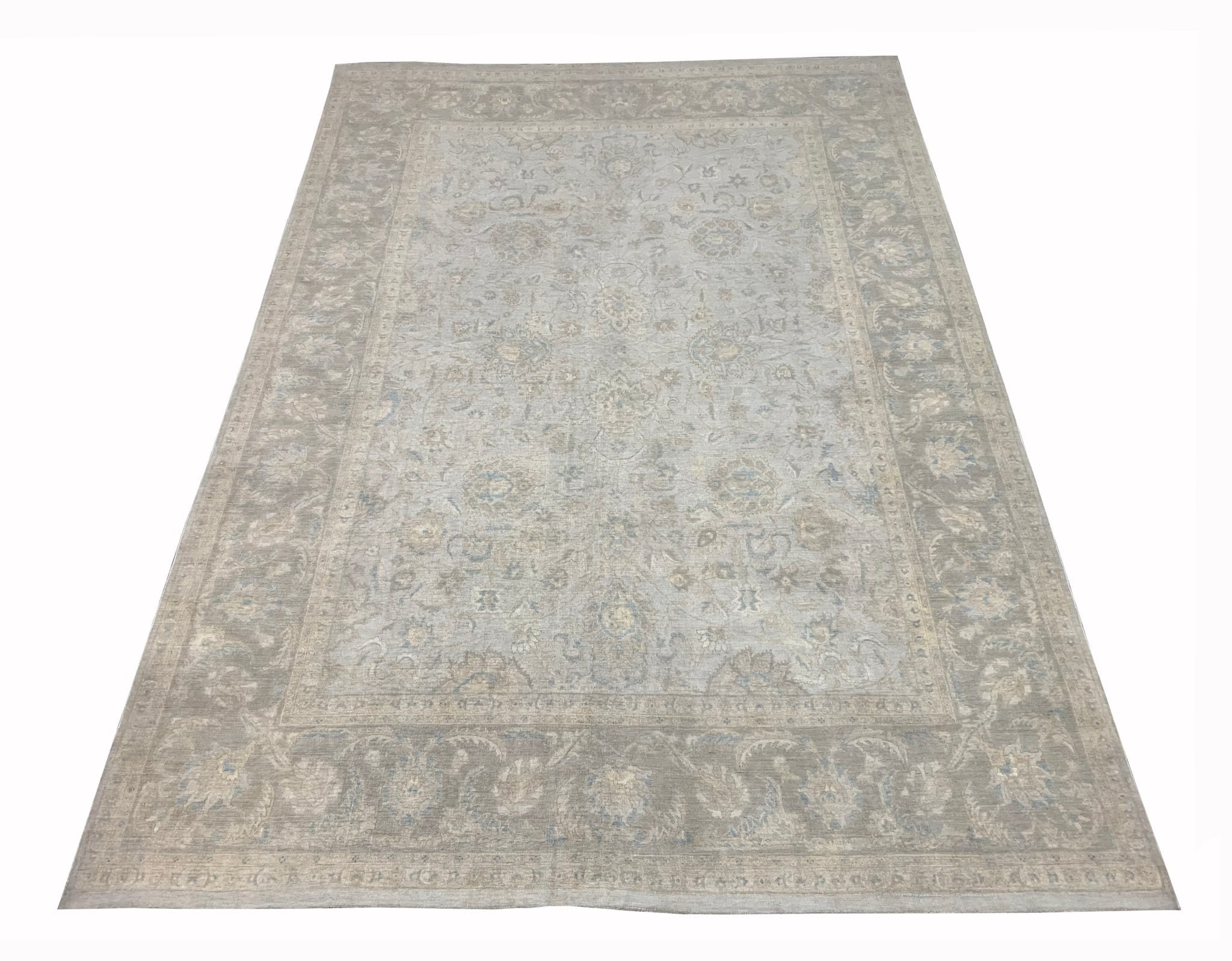 A handmade Afghan Balkh rug featuring a traditional floral pattern in soft grey and beige tones.