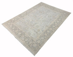 A handmade Afghan Balkh rug featuring a traditional floral pattern in soft grey and beige tones.