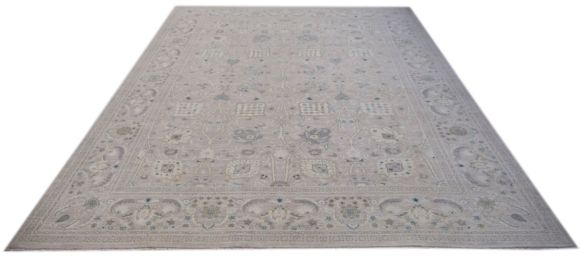 A handwoven Afghan Balkh rug featuring a traditional floral pattern in soft neutral tones.