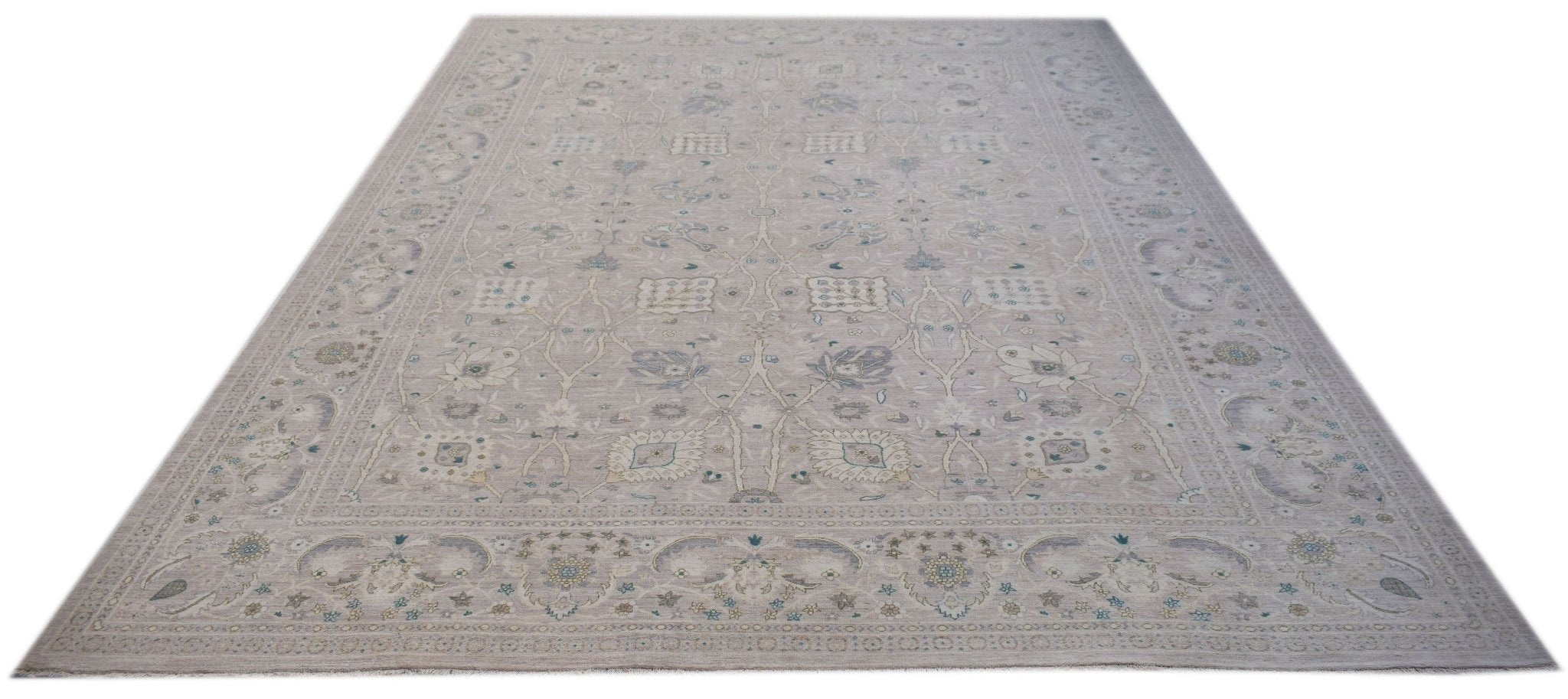 A handwoven Afghan Balkh rug featuring a traditional floral pattern in soft neutral tones.